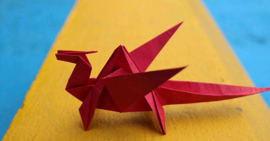 Vibrant red origami dragon displayed on a striking yellow and blue background.